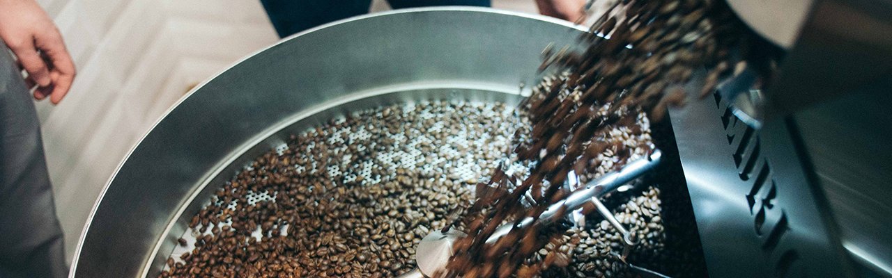 coffee beans roasting in industrial coffee bean roaster